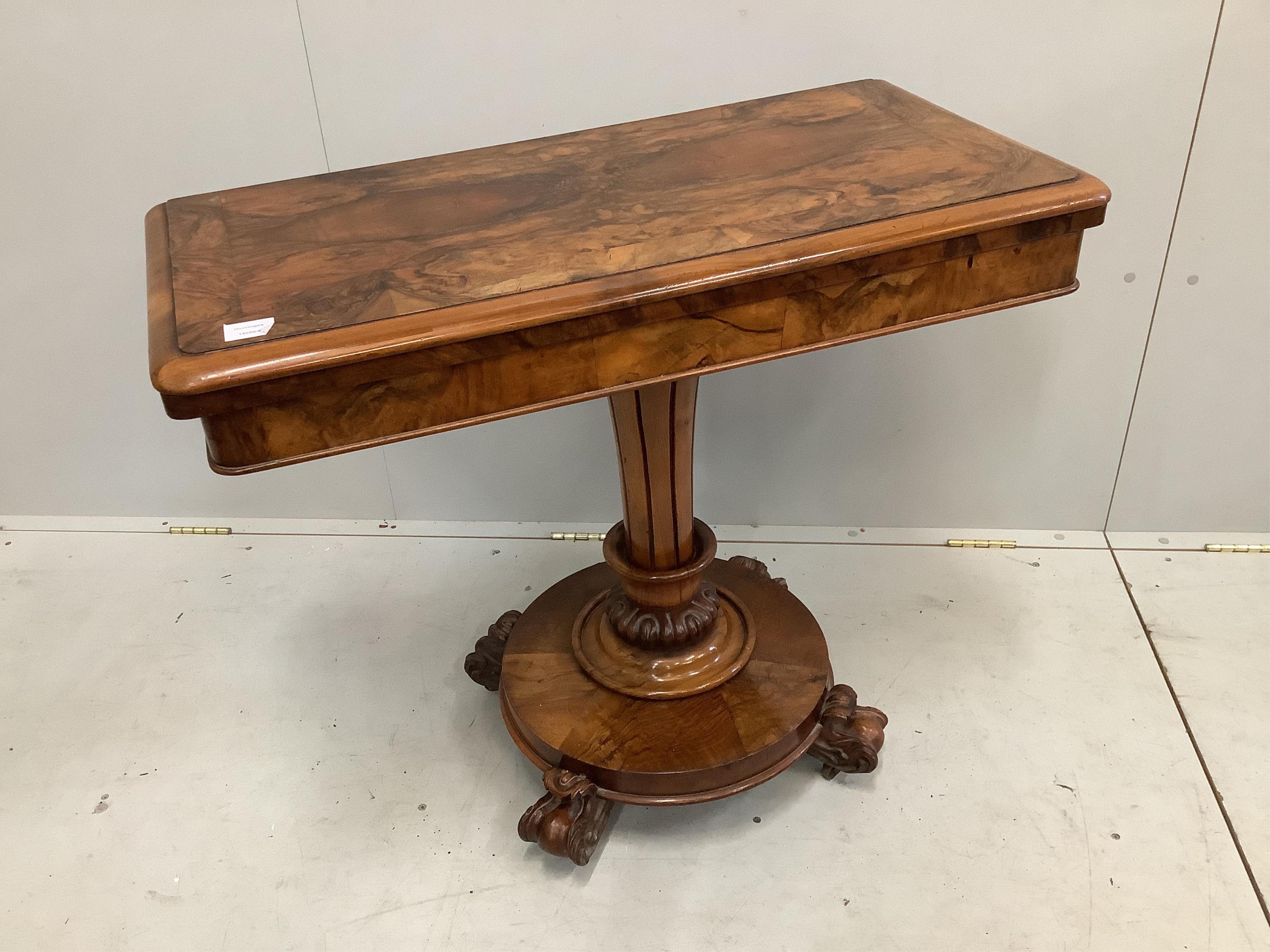 An early Victorian figured walnut rectangular folding card table, width 92cm, depth 44cm, height 77cm. Condition - fair